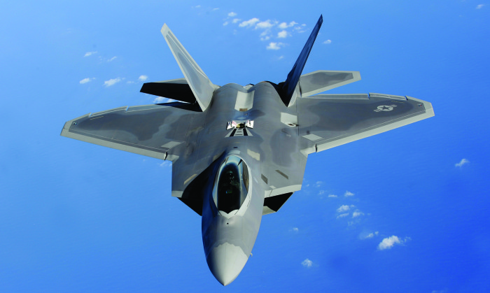 An F-22 Raptor moves into position to receive fuel.