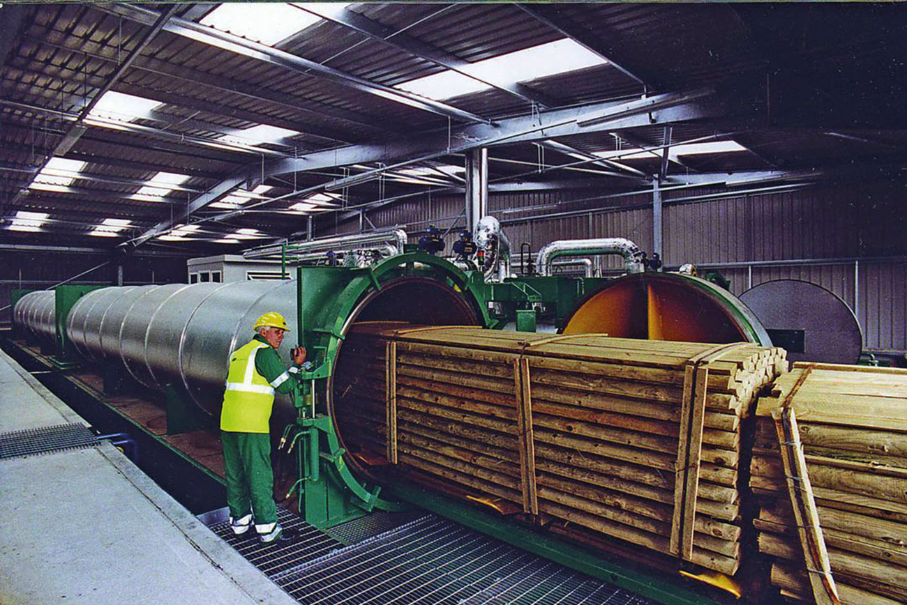 Timber entering the chamber for fire retardant treatment.