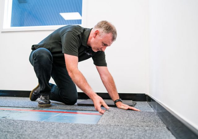 Large area hearing loops are installed discreetly in floors or ceilings.