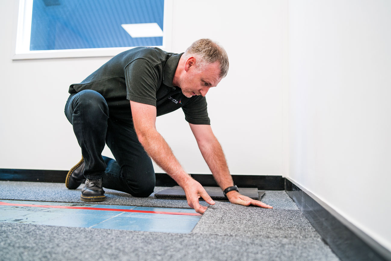 Large area hearing loops are installed discreetly in floors or ceilings.