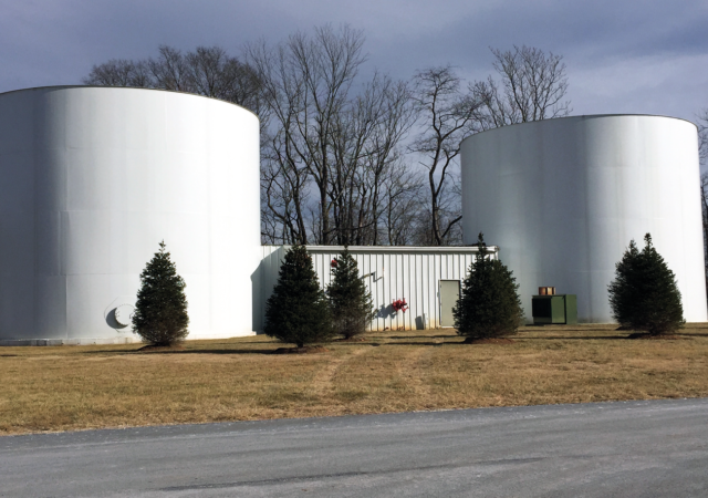 These tanks and their associated fire pump house provide the required fire flow for a remote industrial site.