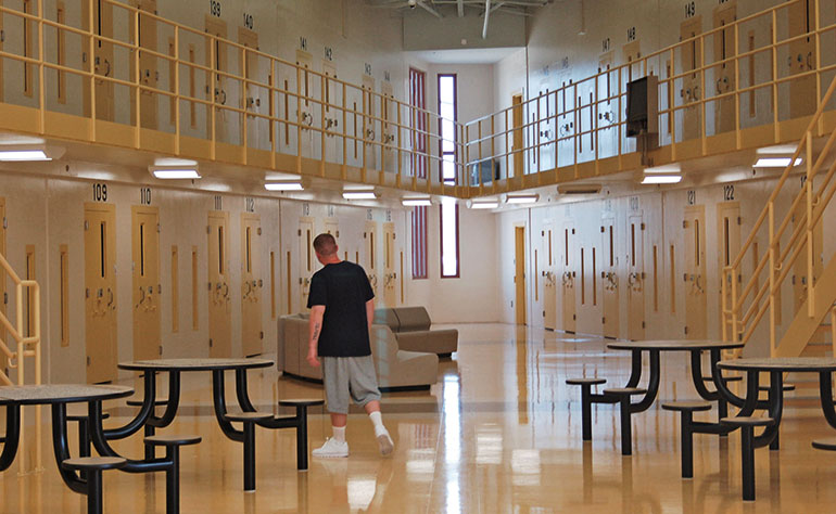 The interior of a typical prison with a day room.
