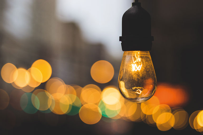 When a short-circuit occurs between the live parts of a system, the current travels through the air or nearby gases.