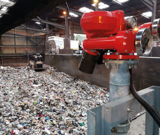 Figure 1: Remote controlled FireDos M2 fire monitor with manual backup on standby in recycling facility.