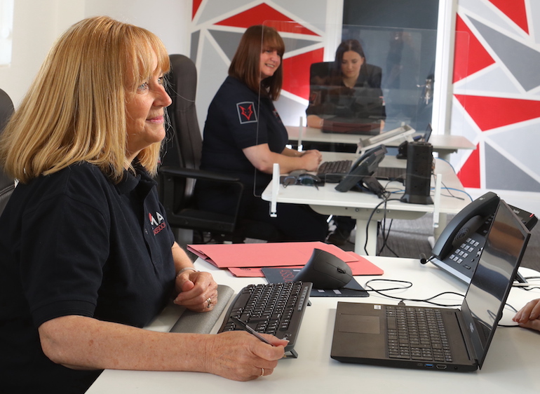 Associate Director Joanna Lowe mans the phones alongside colleagues at the new MAF Associates head office. (MAF Associates)