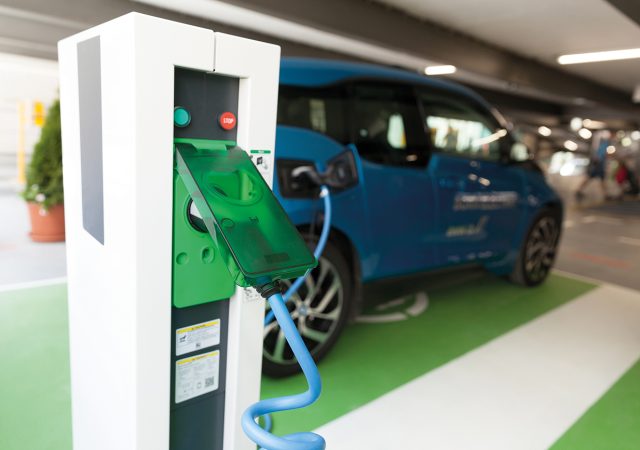 Electric vehicle at charging station in a car park. Images supplied by Author / Contributor